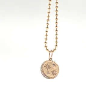 Gold moon and stars disc pendant