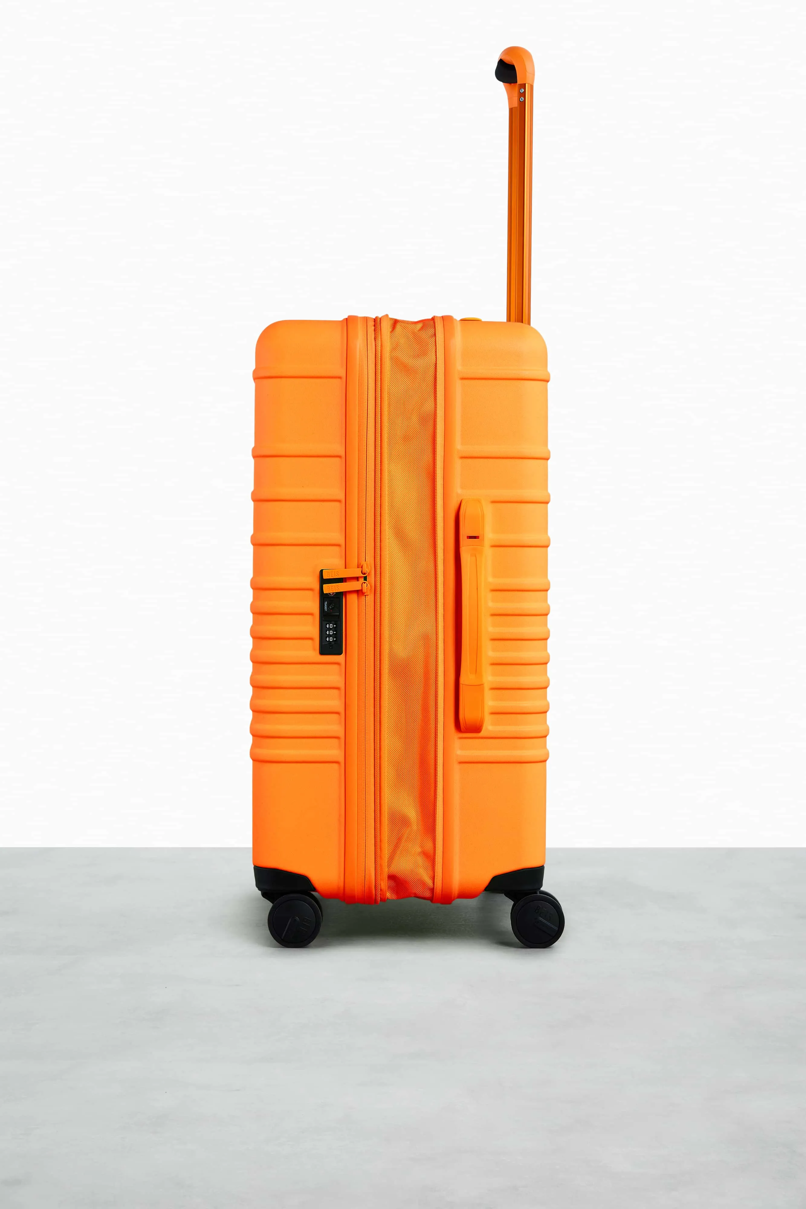 The Medium Check-In Roller in Creamsicle